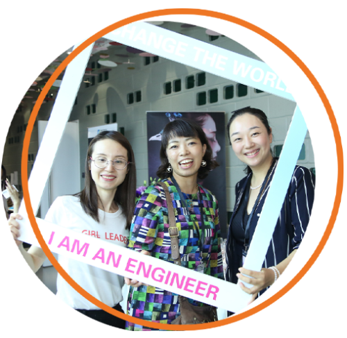 Three young women pose in a frame that reads "I am an engineer."
